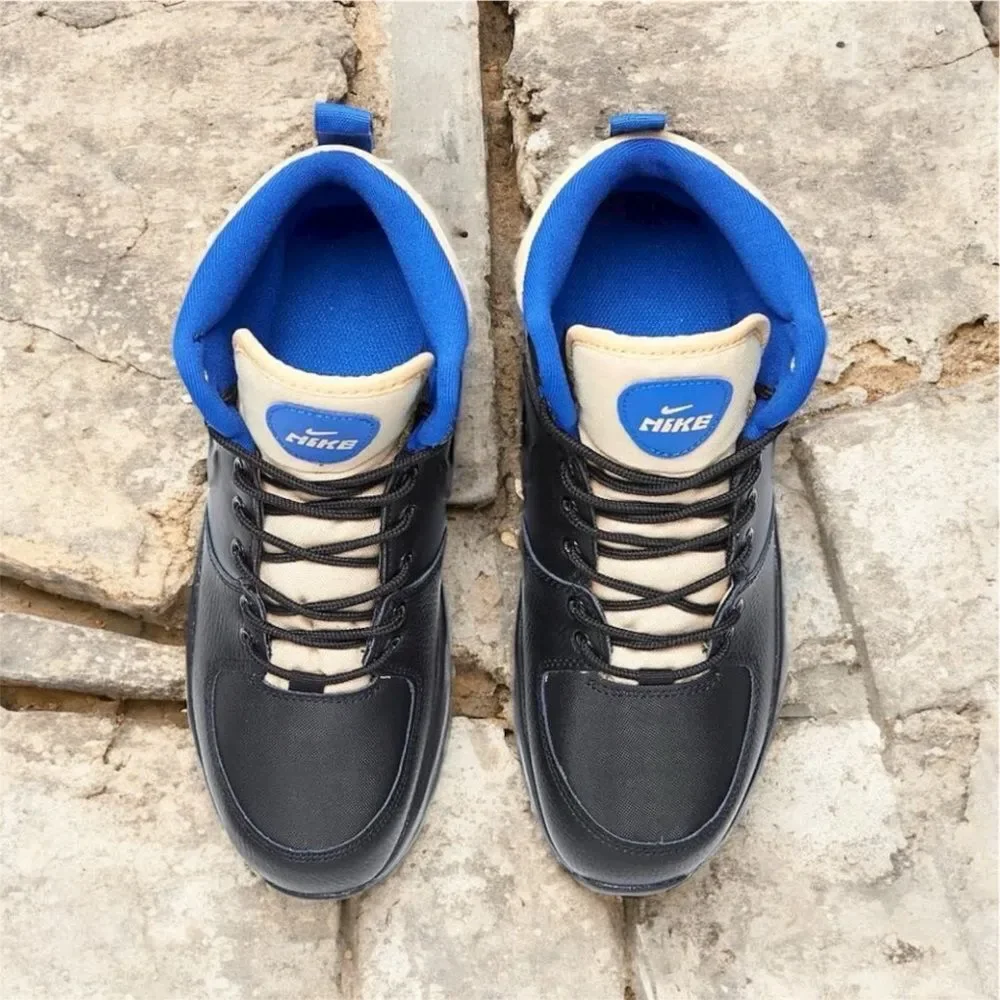 Nike Manoa LTR kids boots in the Black/Black-Sesame-Game Royal. Size 3Y